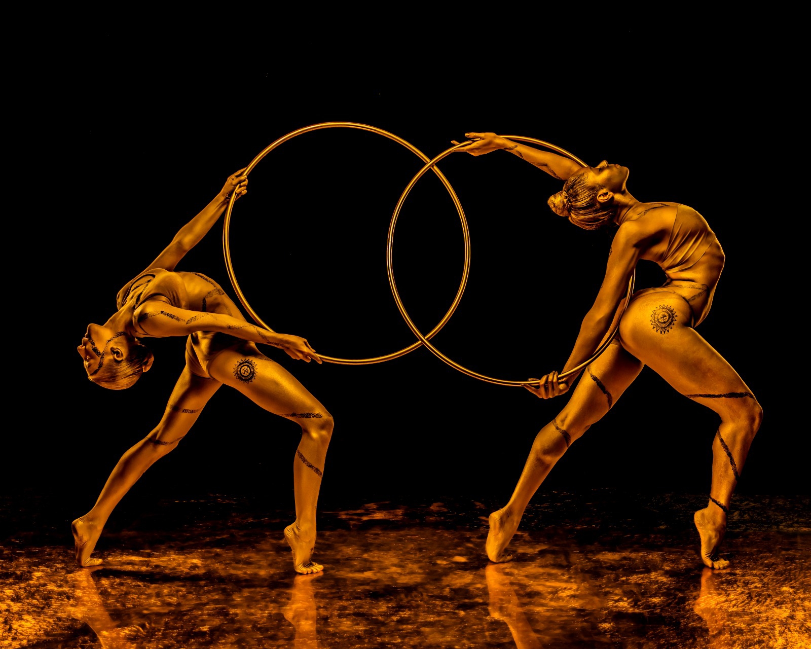 Azra Dewan in gold body art, side profile