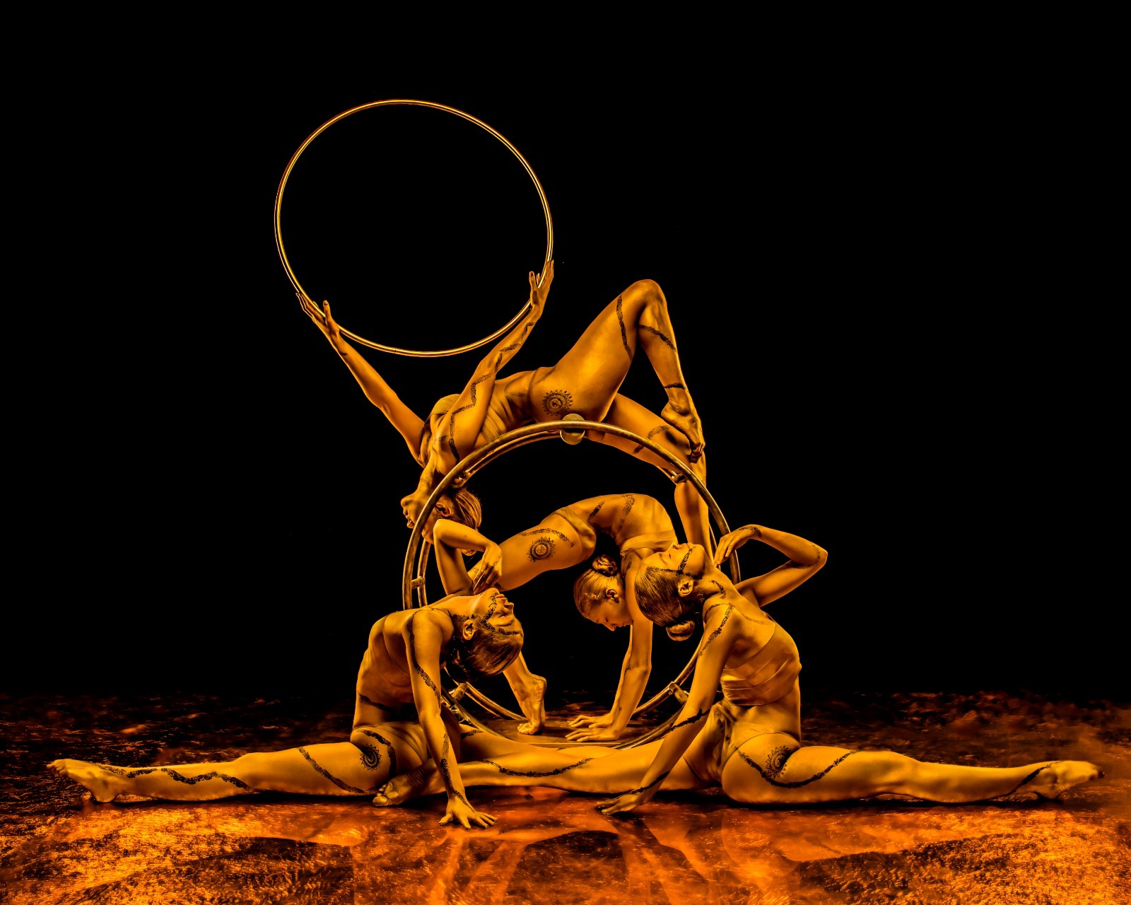 Azra Dewan in gold body art, full pose